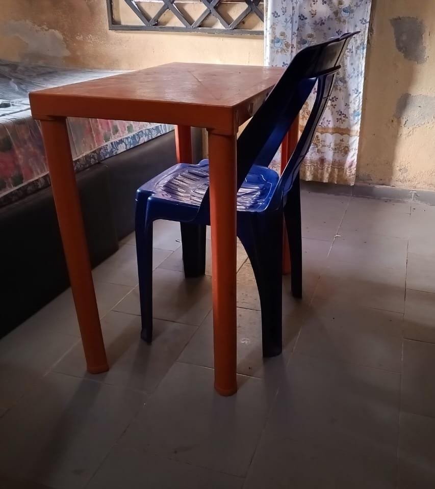 A plastic table and chair for sale.